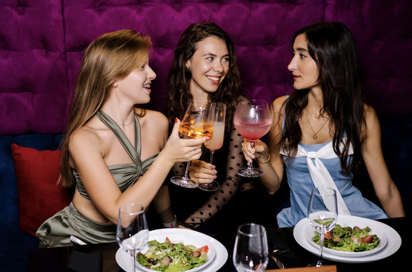 Friends at a table in The Negroni